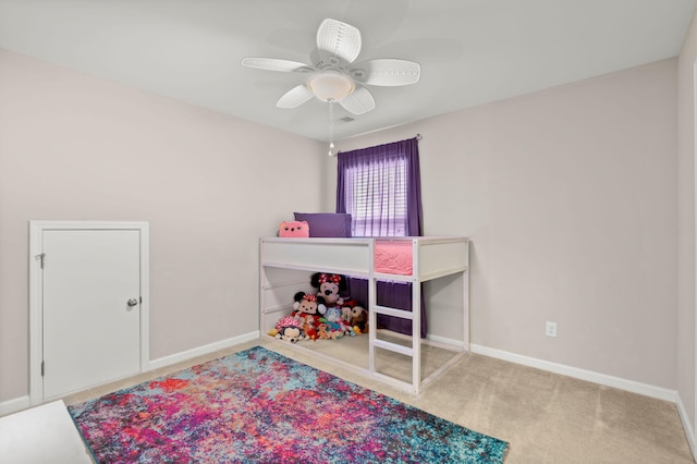 bedroom with ceiling fan and carpet flooring