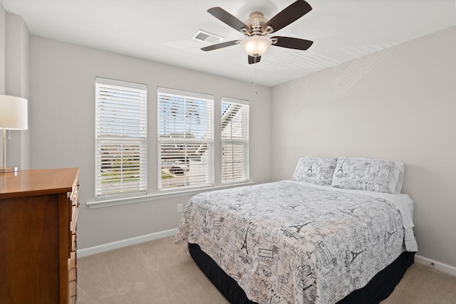 bedroom featuring ceiling fan and light colored carpet