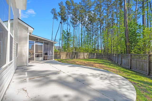 view of patio featuring a sunroom