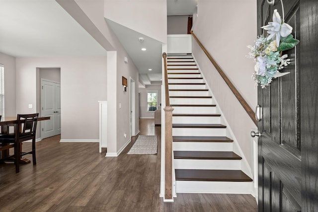 foyer entrance with dark hardwood / wood-style flooring