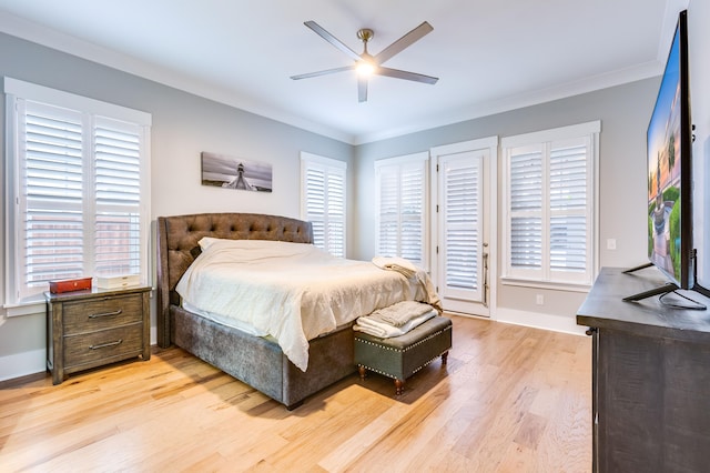 bedroom featuring light wood-type flooring, ceiling fan, baseboards, and crown molding