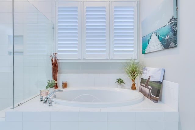 bathroom with a garden tub