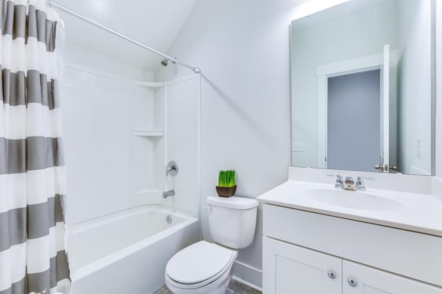 bathroom with vaulted ceiling, shower / bath combo with shower curtain, vanity, and toilet