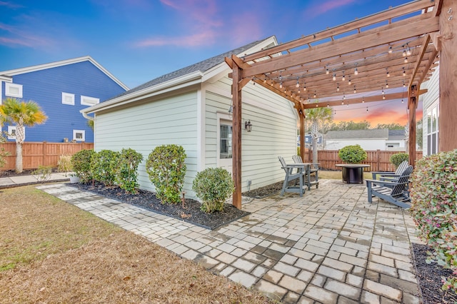 view of patio / terrace featuring fence and a pergola