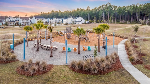 exterior space featuring a residential view, playground community, and a yard