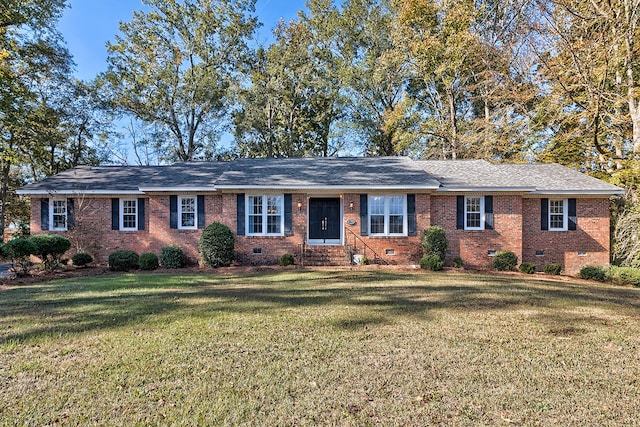 ranch-style house featuring entry steps, crawl space, brick siding, and a front lawn