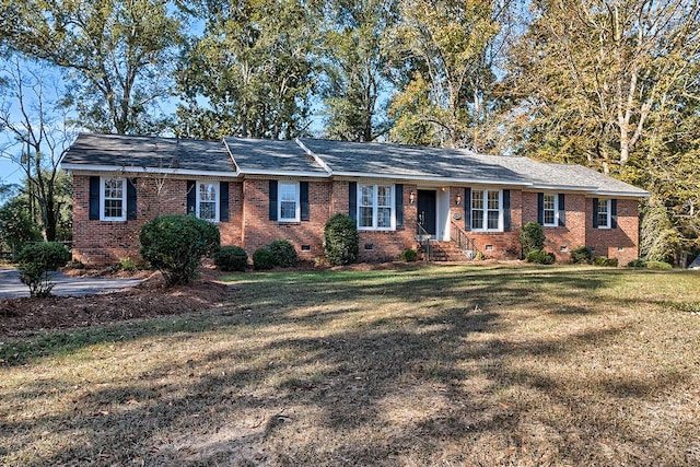 ranch-style home with crawl space, brick siding, and a front lawn