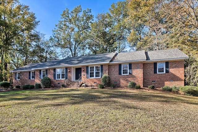 ranch-style house featuring a front yard, crawl space, and brick siding