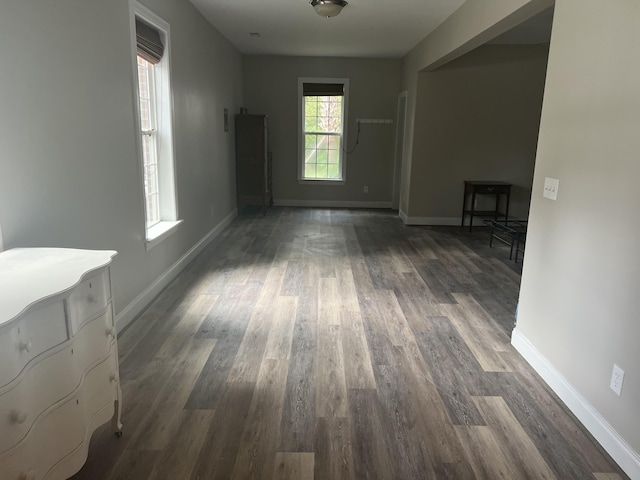 corridor with dark wood-type flooring