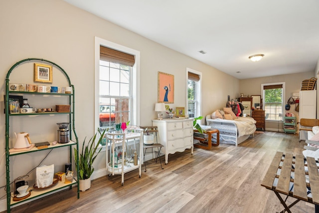 bedroom with light hardwood / wood-style floors