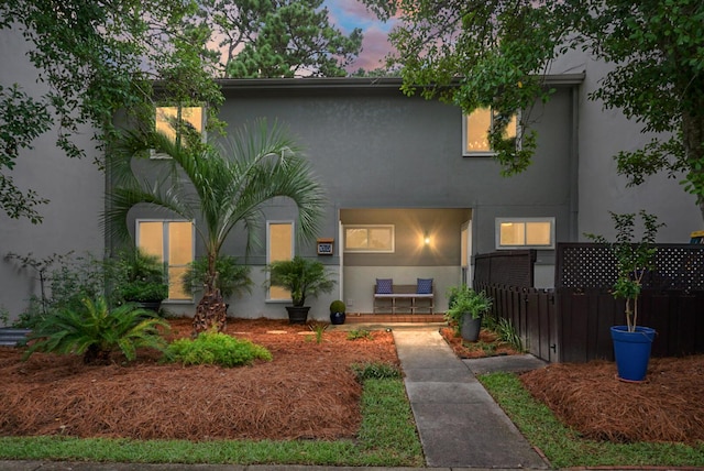 1603 Ventura Pl, Mount Pleasant, SC 29464 - view of front facade with stucco siding and fence