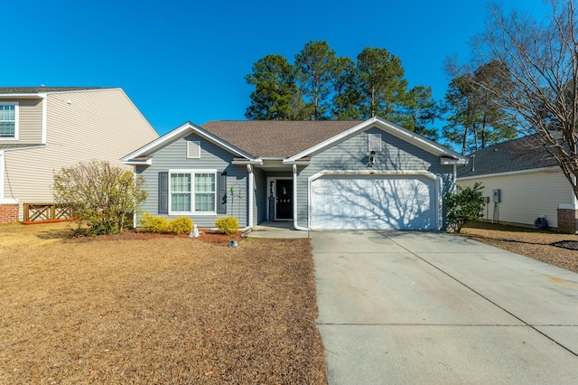 single story home featuring a garage and a front lawn