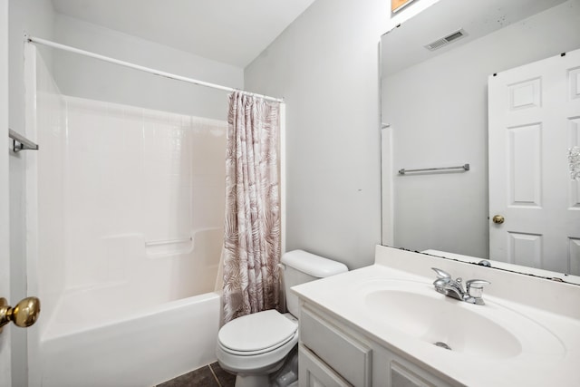 full bathroom with tile patterned floors, vanity, toilet, and shower / bath combo with shower curtain