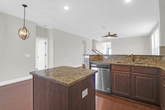 kitchen featuring a kitchen island with sink, dishwasher, plenty of natural light, and sink