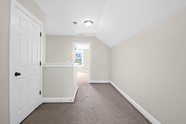 additional living space with carpet floors and lofted ceiling