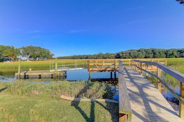 view of dock with a water view and a rural view