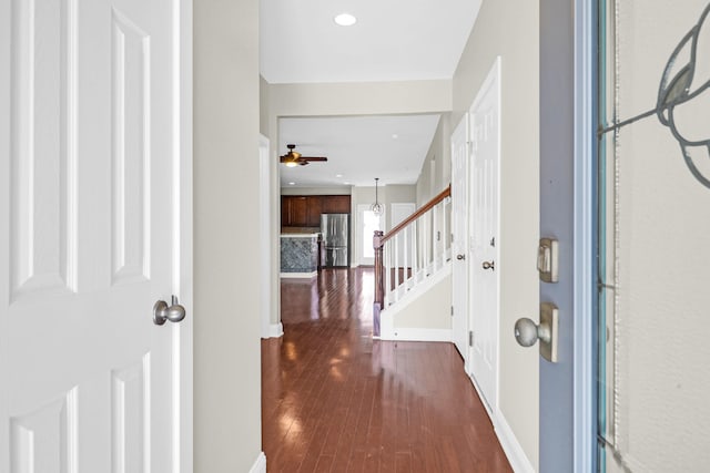 foyer entrance featuring dark hardwood / wood-style flooring and ceiling fan