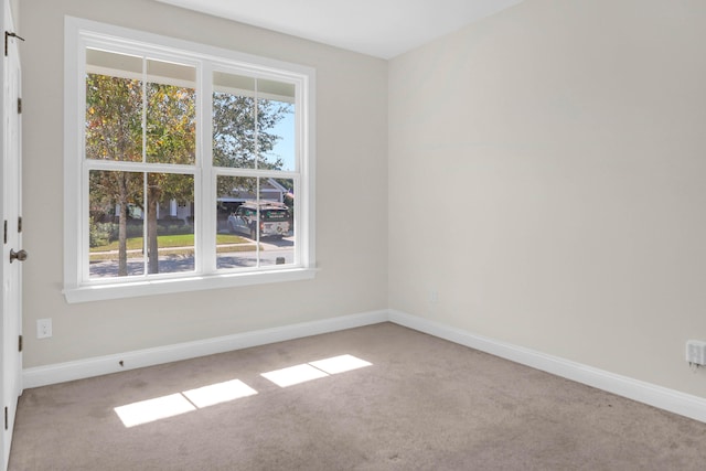 empty room featuring light colored carpet