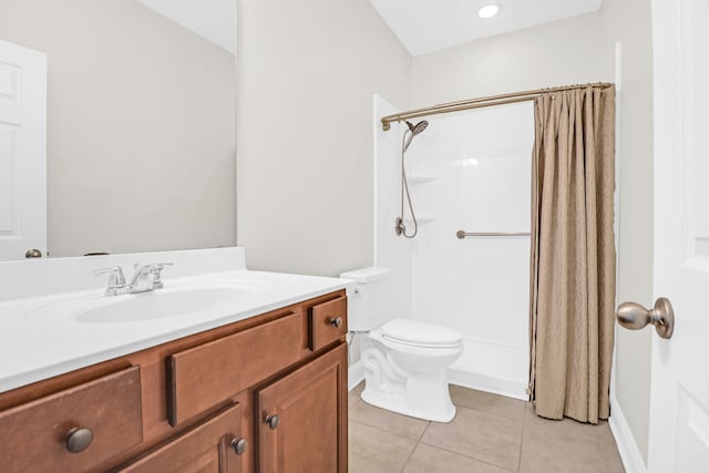 bathroom with tile patterned flooring, vanity, toilet, and curtained shower