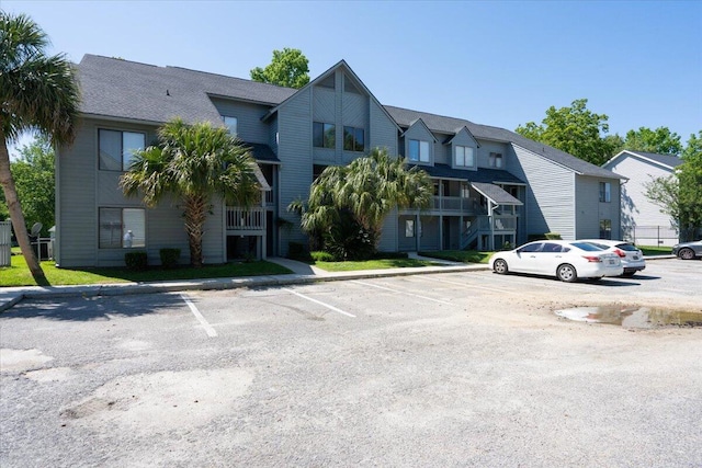 view of front of house featuring a balcony