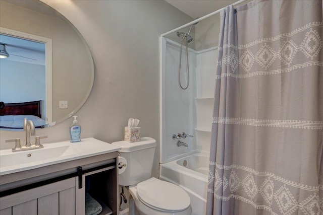 full bathroom featuring shower / bath combo, toilet, and vanity