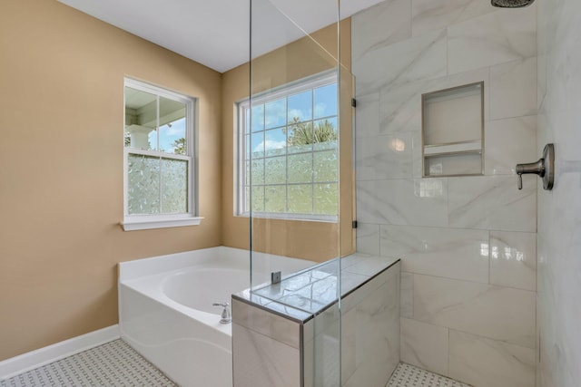 bathroom with shower with separate bathtub and tile patterned floors