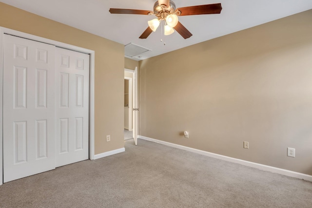 unfurnished bedroom featuring light carpet, a closet, and ceiling fan