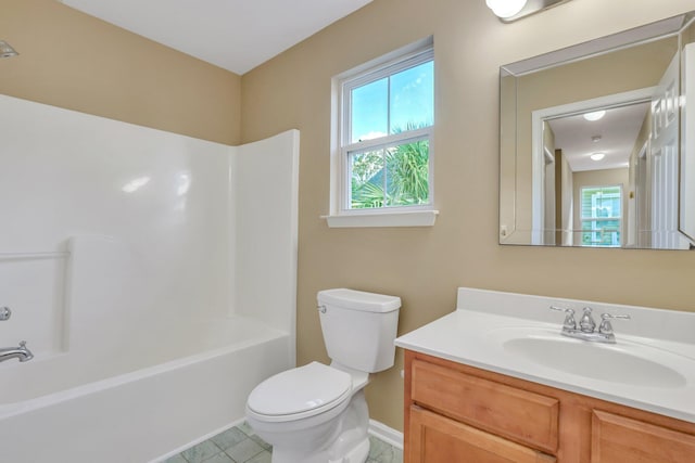 full bathroom featuring bathtub / shower combination, vanity, toilet, and tile patterned flooring