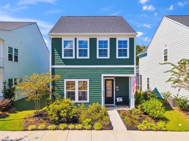 view of front of property with covered porch and central AC unit