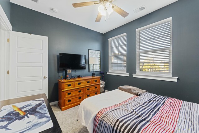 carpeted bedroom featuring ceiling fan