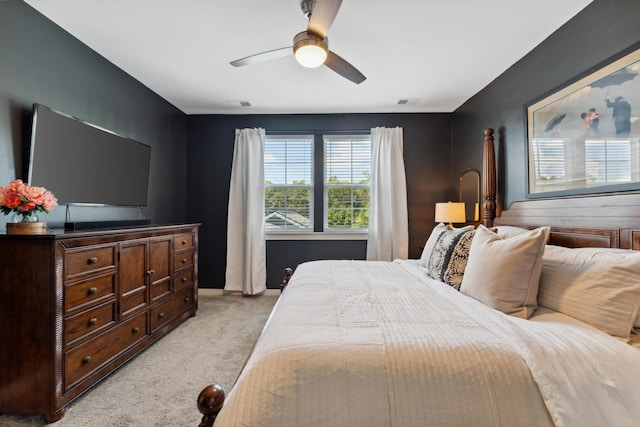 bedroom featuring ceiling fan and light carpet