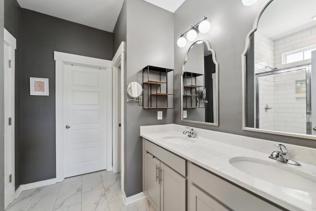 bathroom featuring vanity and a shower with door