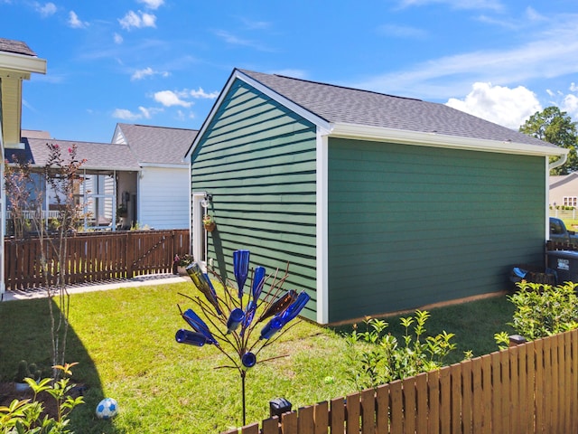 view of outbuilding featuring a lawn