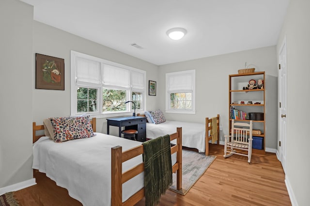 bedroom with hardwood / wood-style flooring