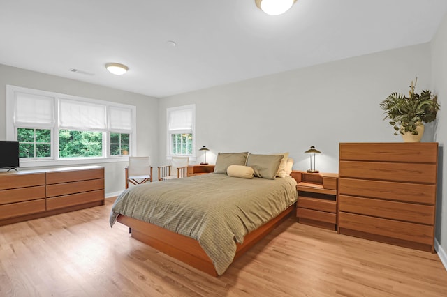 bedroom with light hardwood / wood-style flooring