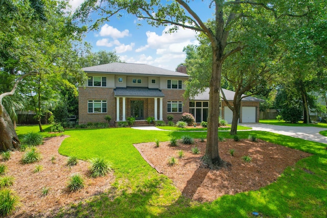 view of front facade featuring a garage and a front lawn