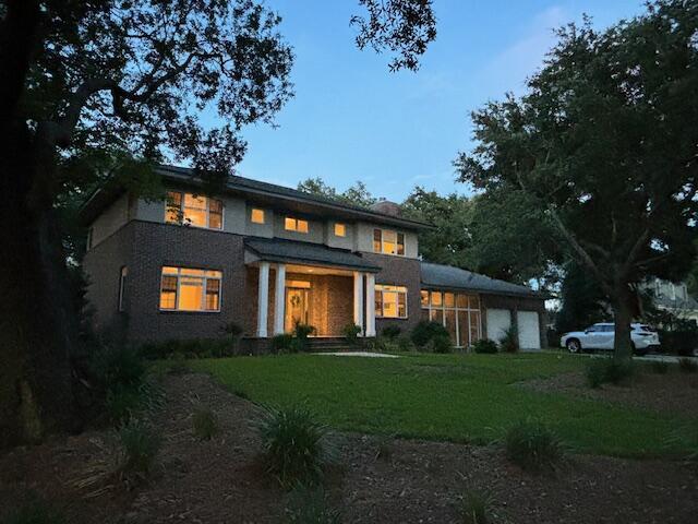 view of front of home featuring a garage and a front lawn