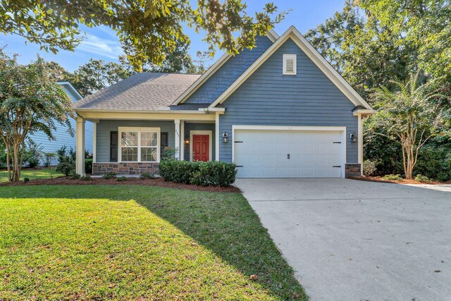235 Club Gate, Bluffton, SC 29910 - view of front of house featuring a front lawn, a shingled roof, a garage, driveway, and stone siding