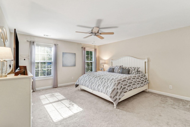 bedroom featuring ceiling fan and light colored carpet