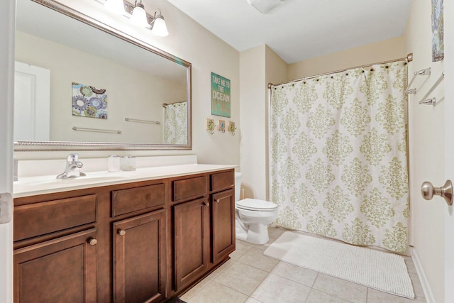 bathroom featuring tile patterned flooring, a shower with curtain, vanity, and toilet