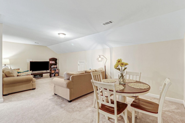 235 Club Gate, Bluffton, SC 29910 - dining area featuring visible vents, vaulted ceiling, light carpet, and baseboards