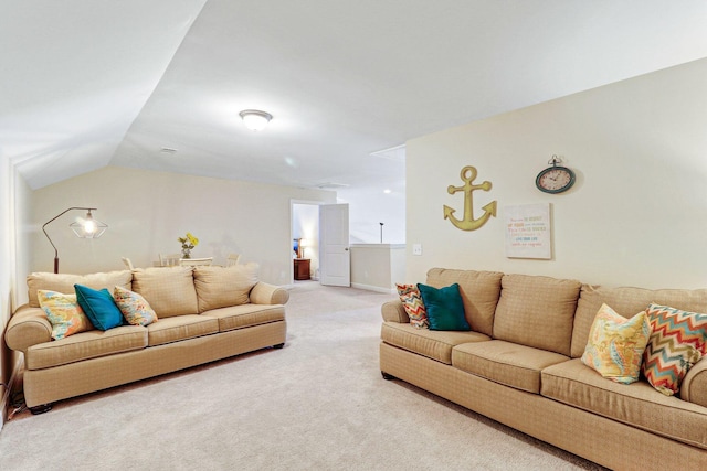 carpeted living room with lofted ceiling