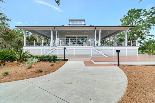 235 Club Gate, Bluffton, SC 29910 - farmhouse featuring a porch, ceiling fan, and stairway