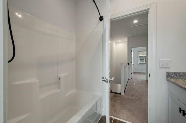 bathroom with shower / bath combination, vanity, and recessed lighting