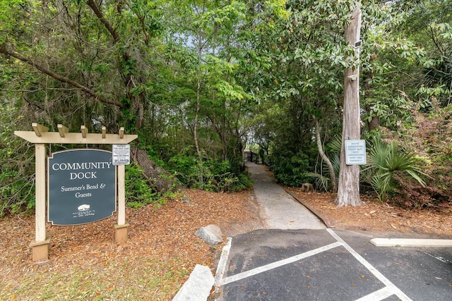 view of home's community featuring uncovered parking
