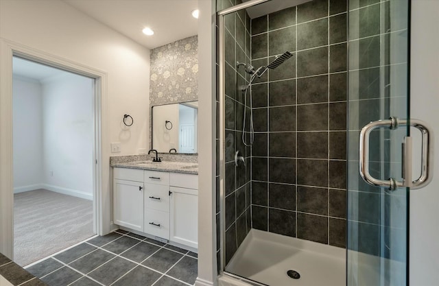 bathroom with vanity, baseboards, recessed lighting, tile patterned floors, and a shower stall
