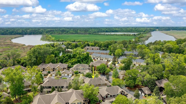 birds eye view of property featuring a residential view and a water view