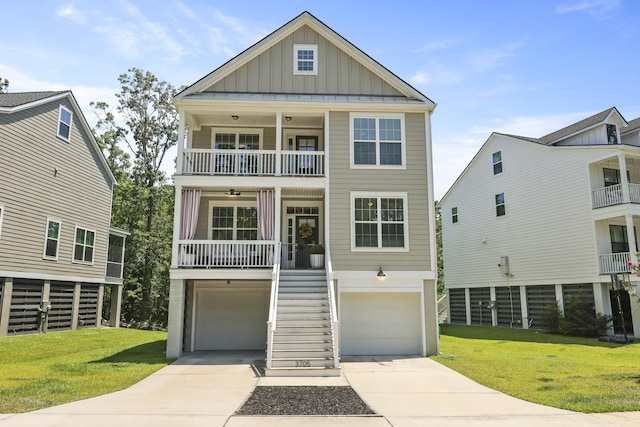 3705 Sandy Gate Ln, Mount Pleasant, SC 29466 - beach home with board and batten siding, stairs, covered porch, a garage, and a front lawn