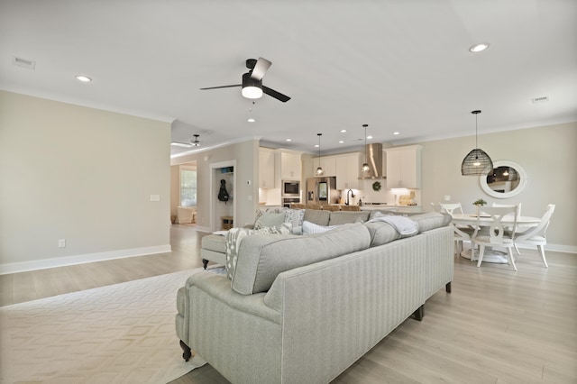 3705 Sandy Gate Ln, Mount Pleasant, SC 29466 - living area featuring ceiling fan, ornamental molding, recessed lighting, and light wood-style flooring