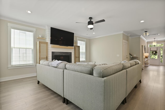 3705 Sandy Gate Ln, Mount Pleasant, SC 29466 - living room featuring a ceiling fan, a fireplace, crown molding, light wood-type flooring, and recessed lighting